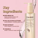 Makeup melting cleansing oil bottle with key ingredients listed on a pink background